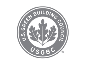 U.S. Green Building Council circular logo in grey with leaves in the middle