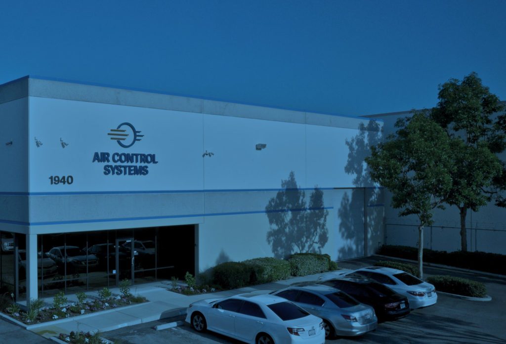 the exterior of the air control systems building from the parking lot